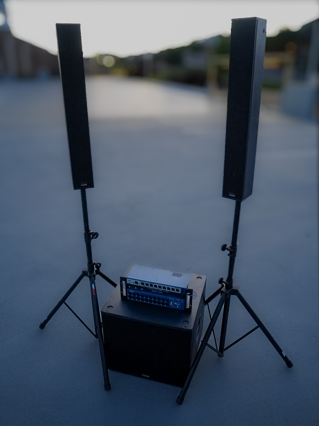 A portable column array PA system with the mixer stacked on the subwoofer