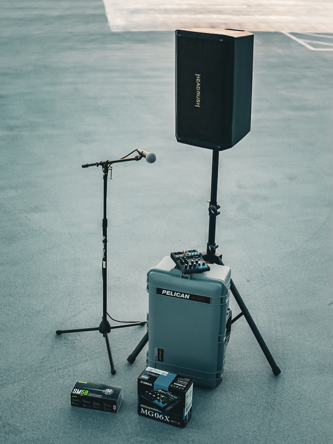 A compact speech package: powered speaker, microphone stand, and Yamaha MG06X mixer