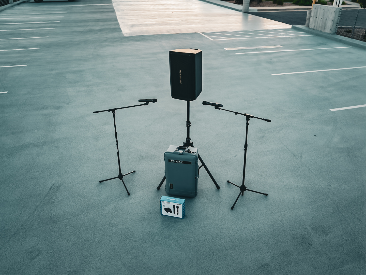 A compact PA and two microphones arranged for a wedding ceremony