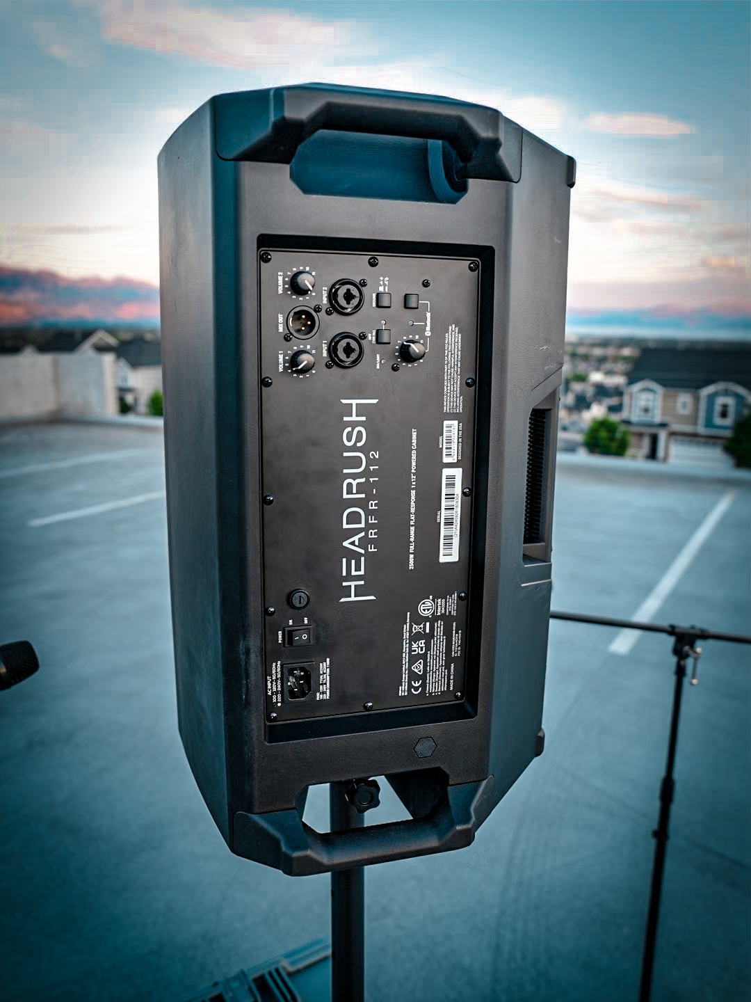 Back panel of a HeadRush powered speaker against a Utah sunset