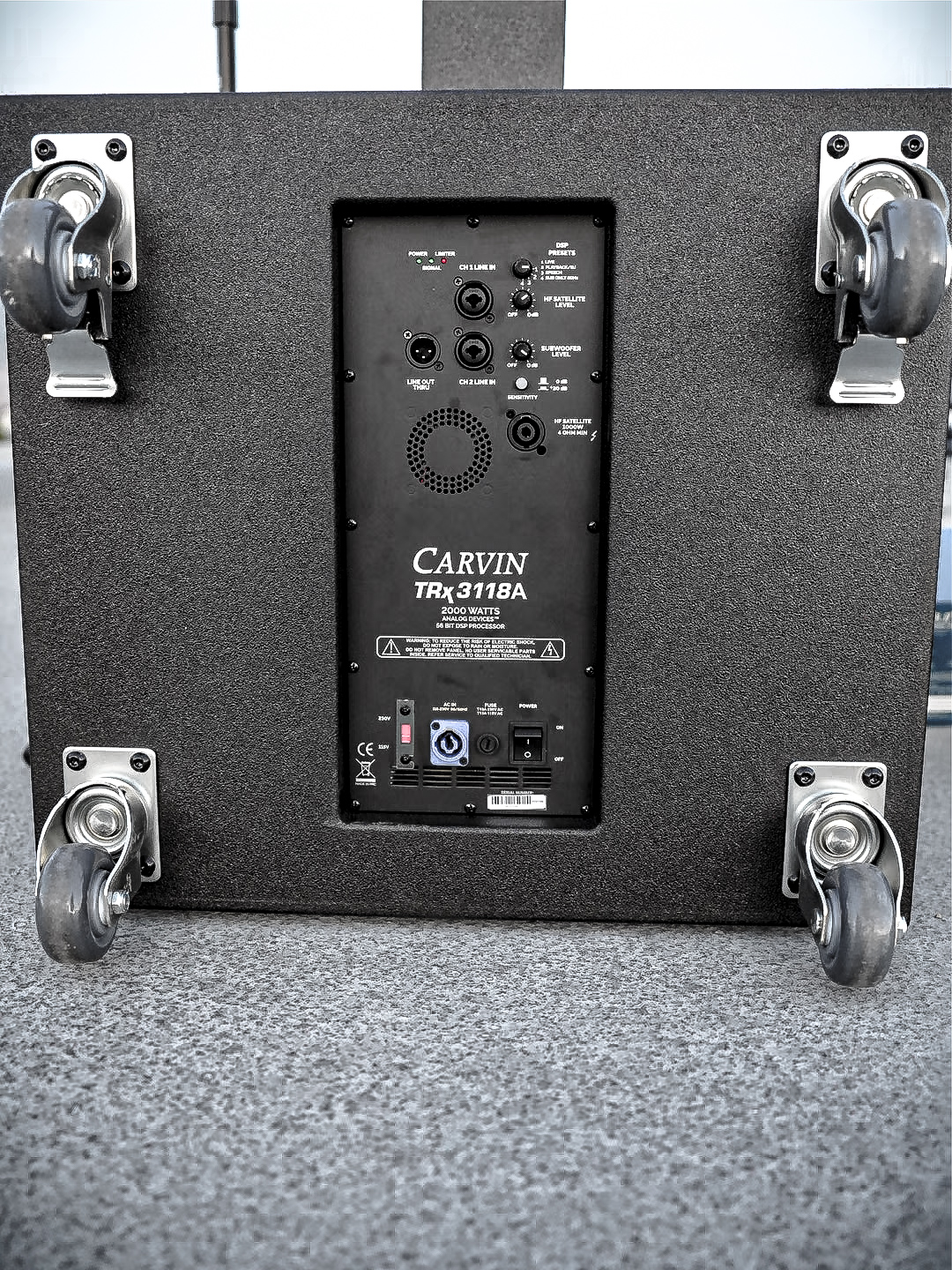 Amplifier panel on the back of a Carvin TRx3118BA powered subwoofer